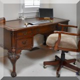 F12. The Ellis Line from Slight claw-and-ball foot desk with leather top. 31”h x 59”w x 29.5”d